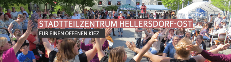 Titelbild Stadtteilzentrum Hellersdorf-Ost - Menschen feiern auf dem Hinterhof das Pressefest